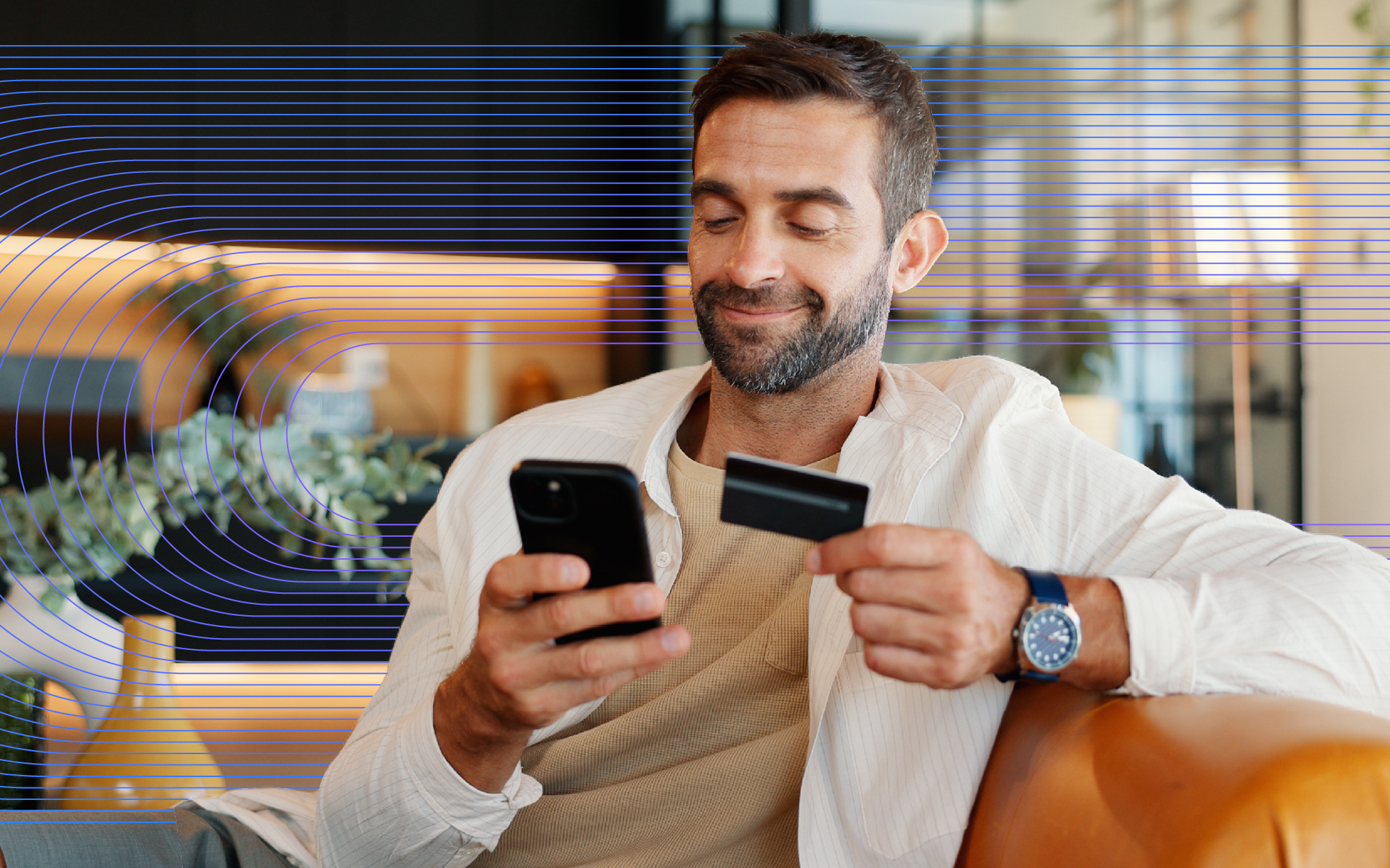 man holding phone and card